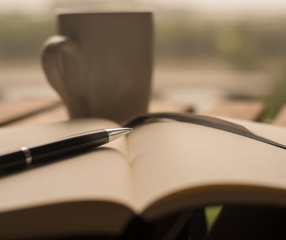 Coffee cup, journal,, pen