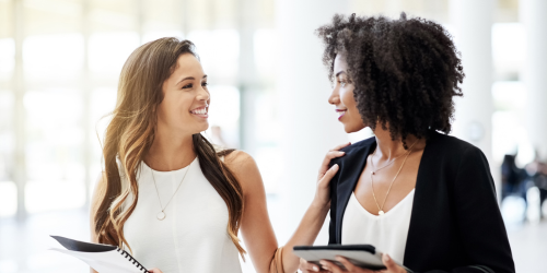 Picture of a woman standing with another woman