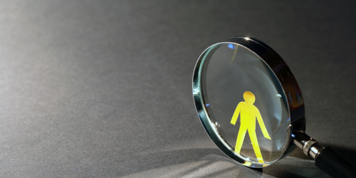 Magnifying glass with person cutout
